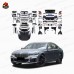 Обвес для BMW 7 серии в стиле старый в новый черного цв